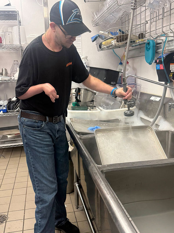 Community employment participant at work