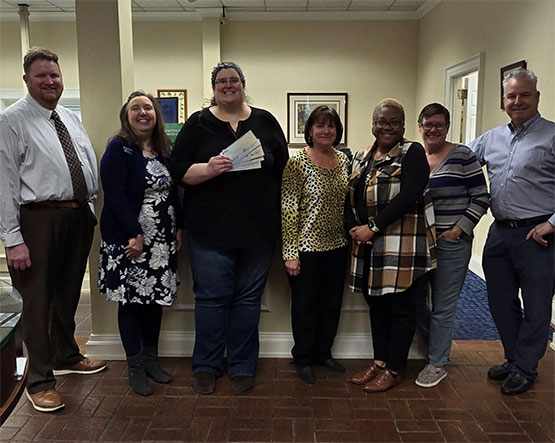 Fidelity Bank representatives presenting a donation to The Workshop of Davidson